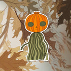 Cartoon character with a pumpkin head on an autumn leaf background